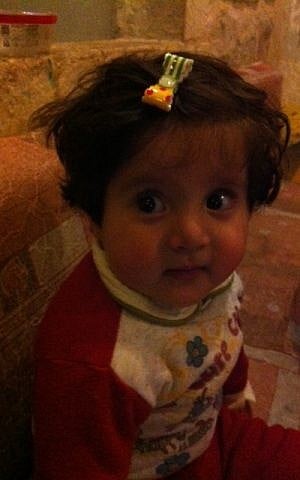 Eighteen month old Iraqi Christian refugee Maryam at the Shevet Achim headquarters in Jerusalem, February 2015 (photo credit: Lazar Berman/Times of Israel)