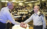 Matzpen commander Col. Avner Ziv (R) receives an award on behalf of his unit from former IDF Chief of Staff Benny Gantz, January 15, 2015 (Photo credit: Courtesy)