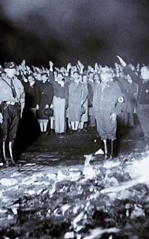 Nazi book-burning incident during the 1930s. (screen capture: YouTube/United States Holocaust Memorial Museum)