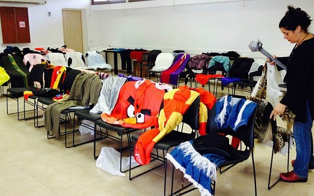 An array of Purim costumes available for all of Kibbutz Ketura's kids (photo credit: Jessica Steinberg/Times of Israel) An array of Purim costumes available for all of Kibbutz Ketura's kids (photo credit: Jessica Steinberg/Times of Israel)