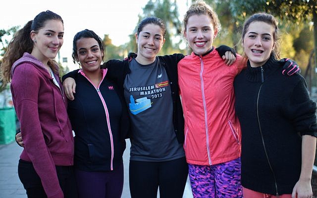 Runners without Borders has two goals: to get girls more active and more self-confident, and to bring together disparate communities. (photo courtesy: Itay Akirav) Runners without Borders has two goals: to get girls more active and more self-confident, and to bring together disparate communities. (photo courtesy: Itay Akirav)