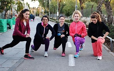 Five of the runners from Runners without Borders during a recent training session. Organizer Shoshana Ben-David, 18, is the second from right. (photo courtesy: Itay Akirav) Five of the runners from Runners without Borders during a recent training session. Organizer Shoshana Ben-David, 18, is the second from right. (photo courtesy: Itay Akirav)