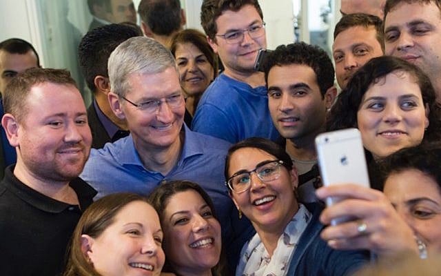 Apple CEO Tim Cook poses for a selfie with Apple's Herzliya employees, February 26, 2015. (photo credit: Courtesy) Apple CEO Tim Cook poses for a selfie with Apple's Herzliya employees, February 26, 2015. (photo credit: Courtesy)