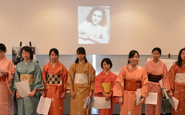 Members of the Small Hands choir of the Beit Shalom congregation speaking about Anne Frank at the Holocaust Education Center in Fukuyama, Japan, December 27, 2014. (photo credit: Cnaan Liphshiz/JTA)
