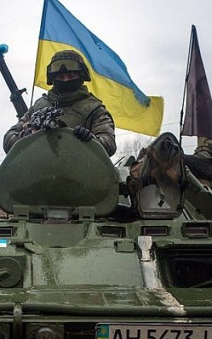 Illustrative: Ukrainian soldiers ride armored vehicles to Debaltseve, eastern Ukraine, Donetsk region, on February 1, 2015. (AFP/Oleksander Stashevsky)