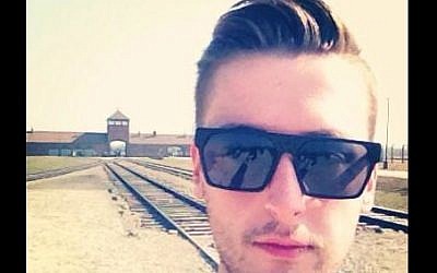 Twitter users like @diamatron, seen taking a selfie at a concentration camp in Poland, have provoked widespread criticism. (screen capture: Twitter)