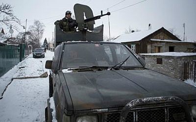 A pro-Russian rebel mans a weapon mounted on a pickup truck in the town of Vuhlehirsk, eastern Ukraine, February 10, 2015 (AP/Vadim Braydov)