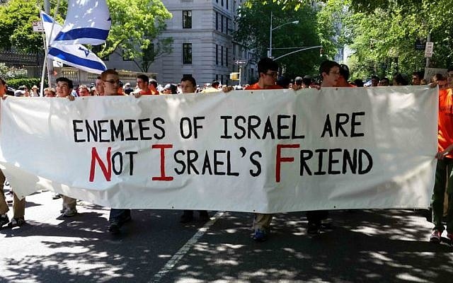 Students from the Rambam Mesivta Jewish day school in Lawrence, NY, march in the 2014 Celebrate Israel Parade, holding a sign stating, Enemies of Israel are Not Israel's Friends,' June 1, 2014. (Rabbi Yotav Eliach/courtesy of Im Tirtzu) Students from the Rambam Mesivta Jewish day school in Lawrence, NY, march in the 2014 Celebrate Israel Parade, holding a sign stating, Enemies of Israel are Not Israel's Friends,' June 1, 2014. (Rabbi Yotav Eliach/courtesy of Im Tirtzu)