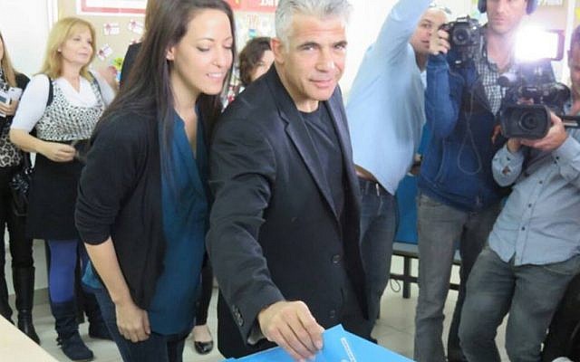 Yair Lapid and his wife Lihi Lapid vote in Tel Aviv on  March 17, 2015. (photo credit: courtesy)