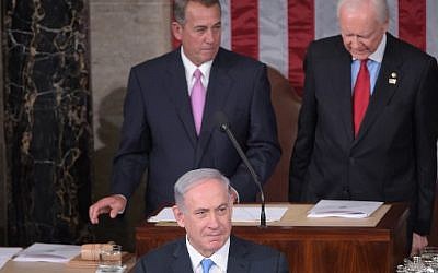 Prime Minister Benjamin Netanyahu addresses a joint session of the US Congress on March 3, 2015 at the US Capitol in Washington. Looking on are House Speaker John Boehner (left) and President pro tempore of the Senate Sen. Orrin Hatch. (photo credit: Mandel Ngan/AFP)