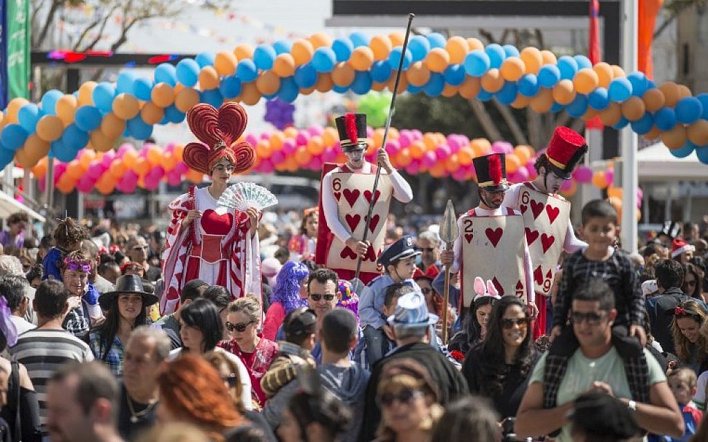 Dressed-up Israelis take part in a parade during the festivities of the Jewish Purim festival on March 5, 2015, in the central Israeli city of Netanya. (photo credit: AFP PHOTO/Jack Guez)