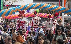 Dressed-up Israelis take part in a parade during the festivities of the Jewish Purim festival on March 5, 2015, in the central Israeli city of Netanya. (photo credit: AFP PHOTO/Jack Guez)
