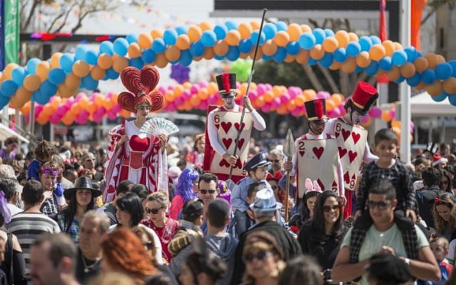 Dressed-up Israelis take part in a parade during the festivities of the Jewish Purim festival on March 5, 2015, in the central Israeli city of Netanya. (photo credit: AFP PHOTO/Jack Guez) Dressed-up Israelis take part in a parade during the festivities of the Jewish Purim festival on March 5, 2015, in the central Israeli city of Netanya. (photo credit: AFP PHOTO/Jack Guez)