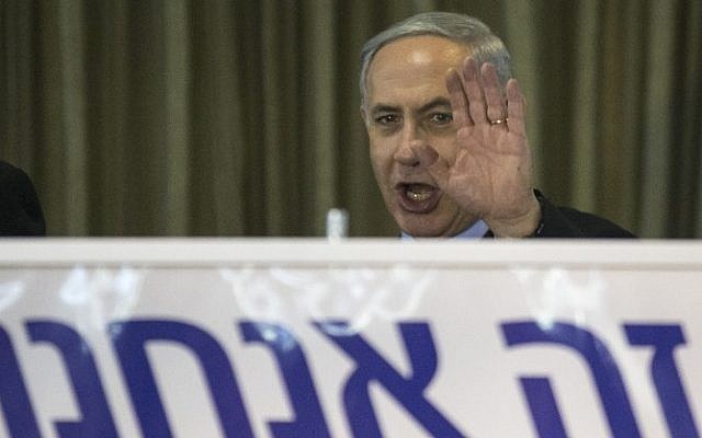 Prime Minister Benjamin Netanyahu, gestures during an election campaign meeting with his supporters in the city of Netanya on March 11, 2015 (photo credit: AFP/JACK GUEZ)