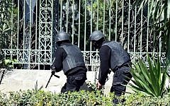 Illustrative: Tunisian security forces secure the area after gunmen attacked Tunis' famed Bardo Museum on March 18, 2015. (photo credit: AFP/ FETHI BELAID)