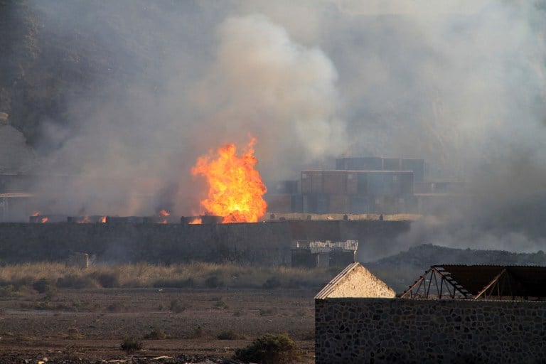Flames and smoke billow from the site of an explosion that hit an arms depot in the Yemenite city of Aden on March 28, 2015. (photo credit: AFP/SALEH AL-OBEIDI) Flames and smoke billow from the site of an explosion that hit an arms depot in the Yemenite city of Aden on March 28, 2015. (photo credit: AFP/SALEH AL-OBEIDI)