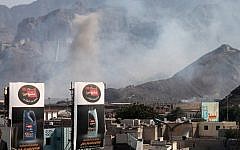 Smoke billows from the site of an explosion that hit an arms depot in Yemen's second city of Aden on March 28, 2015. (photo credit: AFP/SALEH AL-OBEIDI)