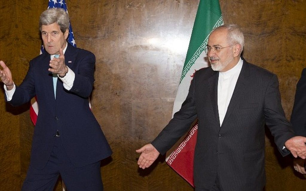 US Secretary of State John Kerry, left, and Iranian Foreign Minister Mohammad Javad Zarif prepare to take their seats for a new round of nuclear negotiations in Montreux, Switzerland, on March 2, 2015.  (photo credit: AFP/POOL /EVAN VUCCI)