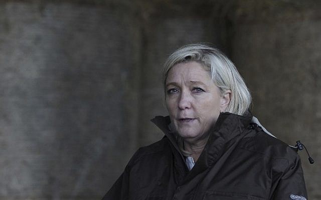 Leader of the French far-right National Front (FN) party Marine Le Pen looks on, March 20, 2015 during a visit to a farm in the northwestern France ahead of local elections. (AFP/CHARLY TRIBALLEAU)