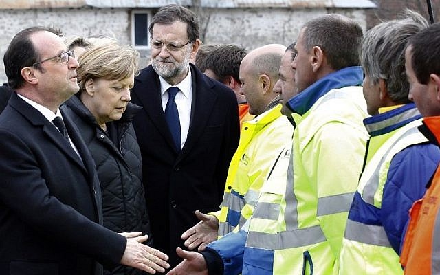 German Chancellor Angela Merkel (C), French President Francois Hollande (L) and Spanish Prime Minister Mariano Rajoy meet rescue workers in Seyne-les-Alpes on March 25, 2015. (photo credit: AFP PHOTO / POOL / CHRISTOPHE ENA)