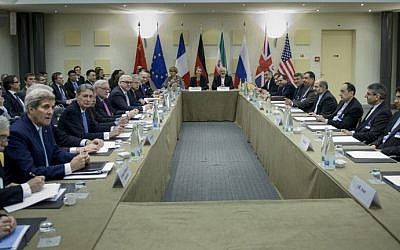 Officials wait for a meeting with diplomats from P5+1, the European Union and Iran at the Beau Rivage Palace Hotel March 31, 2015 in Lausanne. (photo credit: AFP/BRENDAN SMIALOWSKI/POOL)