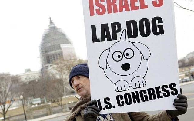 A man demonstrates outside the US Capitol on March 3, 2015 in Washington, DC where Israeli Prime Minister Benjamin Netanyahu is to address a joint meeting of Congress. (photo credit: AFP PHOTO/CHRIS KLEPONIS)