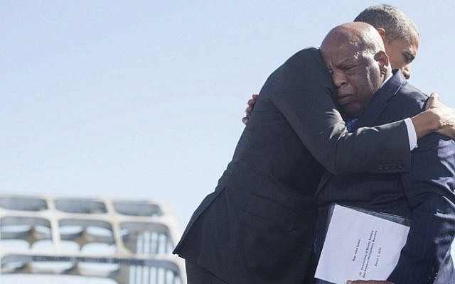 US President Barack Obama, right, hugs US Representative John Lewis, one of the original marchers at Selma, during an event marking the 50th Anniversary of the Selma to Montgomery civil rights marches at the Edmund Pettus Bridge in Selma, Alabama, March 7, 2015. (AFP PHOTO / SAUL LOEB) US President Barack Obama, right, hugs US Representative John Lewis, one of the original marchers at Selma, during an event marking the 50th Anniversary of the Selma to Montgomery civil rights marches at the Edmund Pettus Bridge in Selma, Alabama, March 7, 2015. (AFP PHOTO / SAUL LOEB)