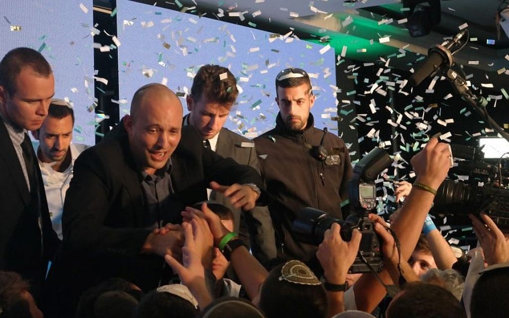 Jewish Home party leader Naftali Bennett waves to onlookers following elections, March 17, 2015. (photo credit: Avi Lewis/Times of Israel, Jon Weidberg)