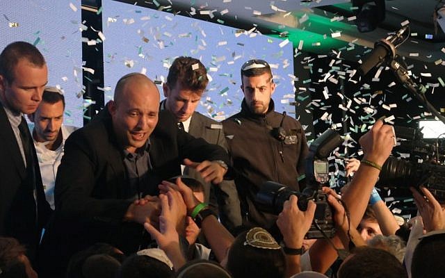 Jewish Home party leader Naftali Bennett waves to onlookers following elections, March 17, 2015. (photo credit: Avi Lewis/Times of Israel, Jon Weidberg) Jewish Home party leader Naftali Bennett waves to onlookers following elections, March 17, 2015. (photo credit: Avi Lewis/Times of Israel, Jon Weidberg)