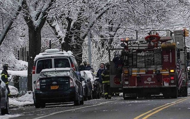 Firefighters walk near the scene of a fire in the Midwood neighborhood in Brooklyn on March 21, 2015 in New York City (Photo credit: Kena Betancur/Getty Images/AFP) Firefighters walk near the scene of a fire in the Midwood neighborhood in Brooklyn on March 21, 2015 in New York City (Photo credit: Kena Betancur/Getty Images/AFP)