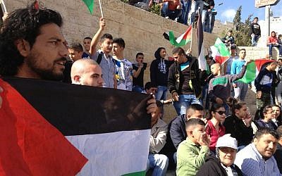 Palestinian demonstrators mark Land Day outside Damascus Gate in East Jerusalem, March 30, 2015 (photo credit: Elhanan Miller/Times of Israel)