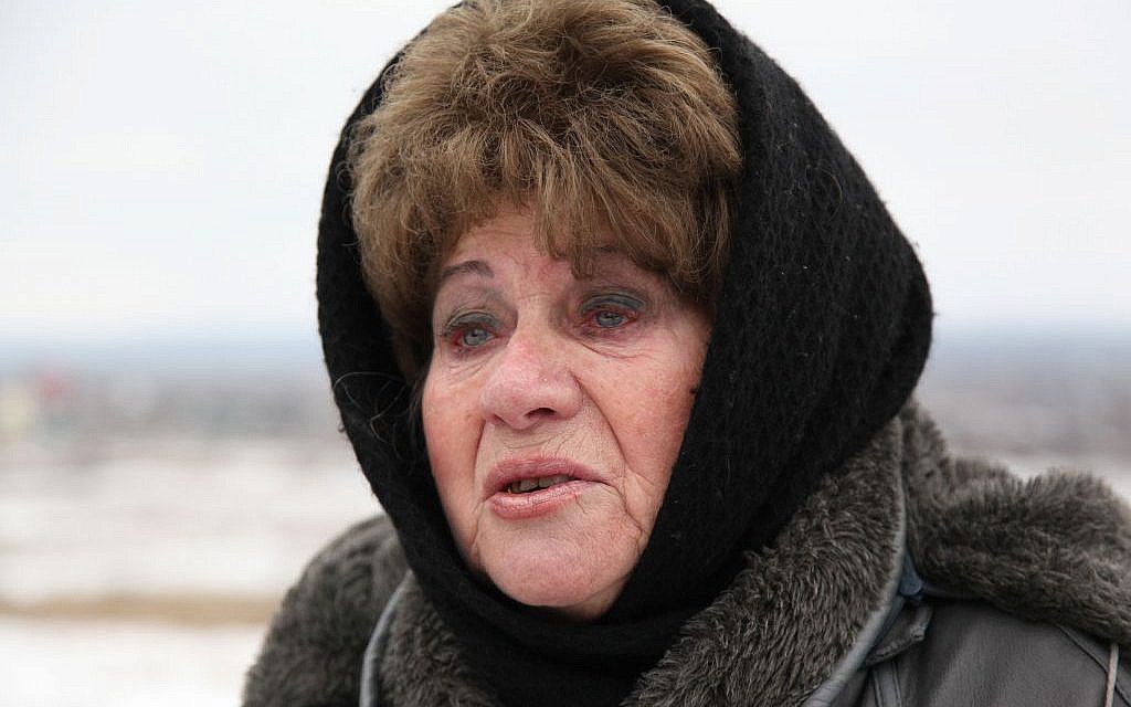 Recent widow Anna Kushnir, 76, from Slavyansk said she is not ready to leave her husband and will stay in Ukraine. (courtesy JDC)