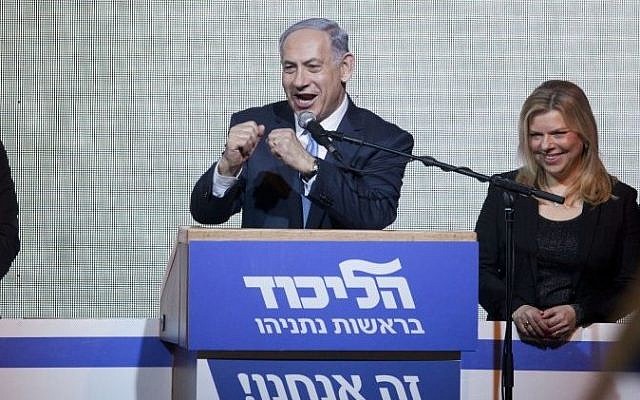 A victorious Prime Minister Benjamin Netanyahu greets supporters at the party's election headquarters In Tel Aviv. early on Wednesday, March 18, 2015. (photo credit: AP Photo/Dan Balilty) A victorious Prime Minister Benjamin Netanyahu greets supporters at the party's election headquarters In Tel Aviv. early on Wednesday, March 18, 2015. (photo credit: AP Photo/Dan Balilty)