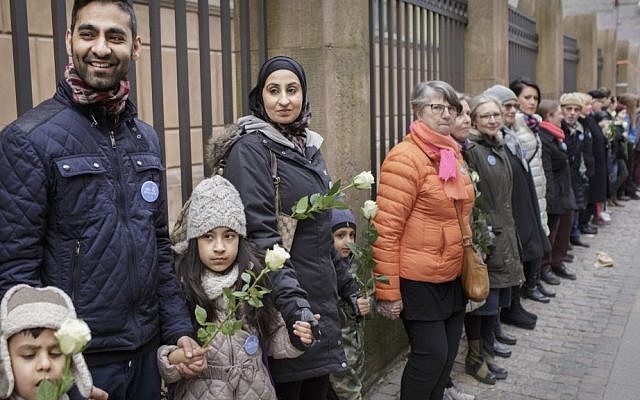 Danish people of Muslim, Jewish and Christian faith form a peace ring around the synagogue in Copenhagen, Saturday, March 14, 2015. (AP Photo/Mads Nissen/Polfoto) Danish people of Muslim, Jewish and Christian faith form a peace ring around the synagogue in Copenhagen, Saturday, March 14, 2015. (AP Photo/Mads Nissen/Polfoto)