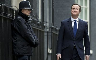 Britain's Prime Minister David Cameron leaves Downing Street to see Queen Elizabeth II for the official dissolution of Parliament, in London, Monday, March 30, 2015. The United Kingdom will go to the polls for a general election on May 7. (photo credit: AP Photo/Alastair Grant)