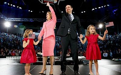 Sen. Ted Cruz, R-Texas, his wife Heidi, and their two daughters Catherine, 4, left, and Caroline, 6, right, wave on stage after he announced his campaign for president, Monday, March 23, 2015 at Liberty University, in Lynchburg, Va. (photo credit: AP/Andrew Harnik)