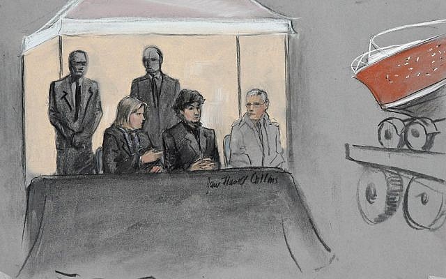 In this courtroom sketch, Dzhokhar Tsarnaev, center seated, is depicted between defense attorneys while the boat in which he was captured in sits on a trailer for observation during his federal death penalty trial, Monday, March 16, 2015, in Boston. Tsarnaev is charged with conspiring with his brother to place two bombs near the Boston Marathon finish line in April 2013, killing three and injuring more than 260 people. (photo credit: AP/Jane Flavell Collins) In this courtroom sketch, Dzhokhar Tsarnaev, center seated, is depicted between defense attorneys while the boat in which he was captured in sits on a trailer for observation during his federal death penalty trial, Monday, March 16, 2015, in Boston. Tsarnaev is charged with conspiring with his brother to place two bombs near the Boston Marathon finish line in April 2013, killing three and injuring more than 260 people. (photo credit: AP/Jane Flavell Collins)