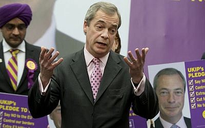 British lawmaker Nigel Farage talks to the media as he launches a poster campaign for the general election for his UKIP party in London Monday, March 30, 2015. The United Kingdom will go to the polls for a general election on May 7. (photo credit: AP/Alastair Grant)