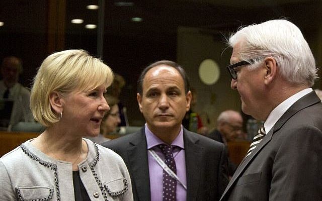 Sweden's Foreign Minister Margot Wallström (left), speaks with German Foreign Minister Frank-Walter Steinmeier (right), during a meeting of EU foreign ministers at the EU Council building in Brussels on Monday, March 16, 2015. (photo credit: AP/Virginia Mayo)