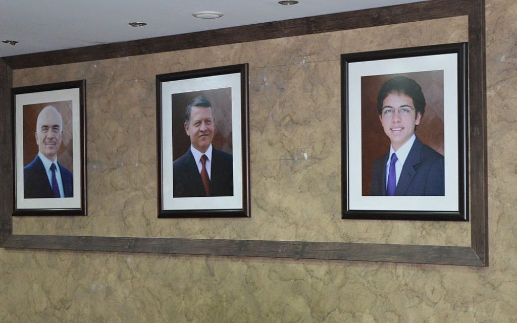 Images of the Jordanian royal family hang from the walls of the Center for Israel Studies, Amman, March 29, 2015 (photo credit: Avi Lewis/Times of Israel)