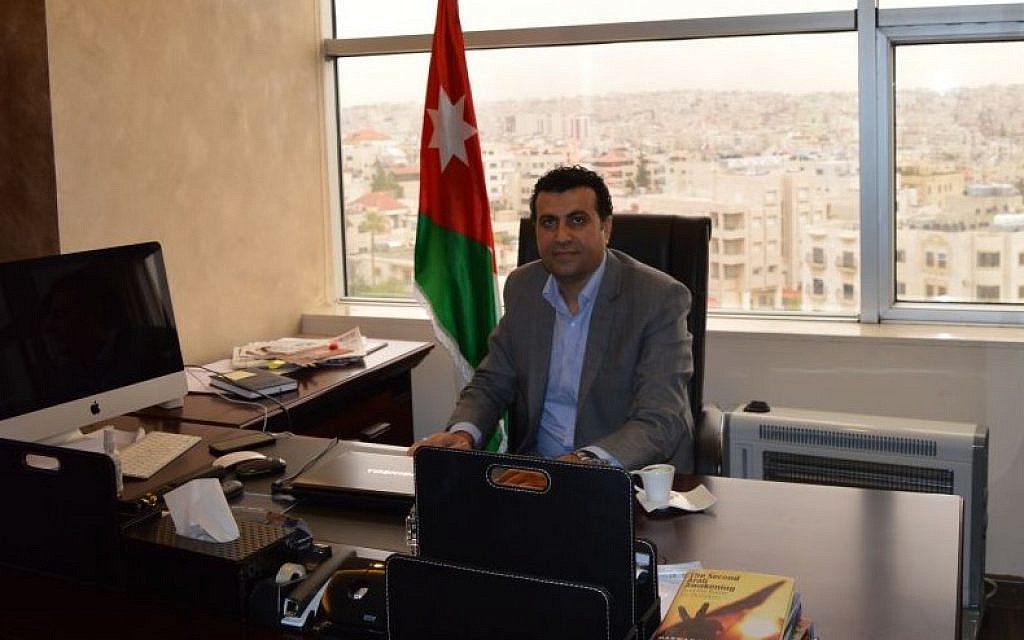 Dr. Abdullah Swalha at his desk at the Center for Israel Studies, Amman, March 29, 2015 (photo credit: Avi Lewis/Times of Israel, Benyamin Loudmer)