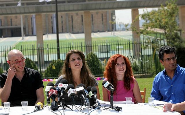 Yossi Yona, far right, next to Daphne Leaf, Stav Shafir and Avia Spivak, the initiators of the 2011 protests against rising housing and property prices, social inequalities and the high cost of living in Israel, in front of Knesset, September 6, 2011 (photo credit: Yossi Zamir/Flash90) Yossi Yona, far right, next to Daphne Leaf, Stav Shafir and Avia Spivak, the initiators of the 2011 protests against rising housing and property prices, social inequalities and the high cost of living in Israel, in front of Knesset, September 6, 2011 (photo credit: Yossi Zamir/Flash90)