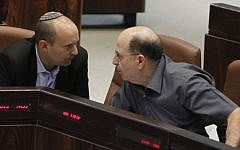 Naftali Bennett (L), then Economy Minister, and Moshe Ya'alon (R), then Defense Minister, seen in the Israeli parliament, June 5, 2013. (Miriam Alster/FLASH90)