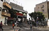 Illustration: African migrants walk past the Tel Aviv central bus station. (Zuzana Janku/Flash90)