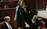 Jewish Home MK Ayelet Shaked is congratulated by Economy Minister Naftali Bennett (left) and then-finance minister Yair Lapid in the Knesset, March 11, 2014. (Miriam Alster/Flash90)