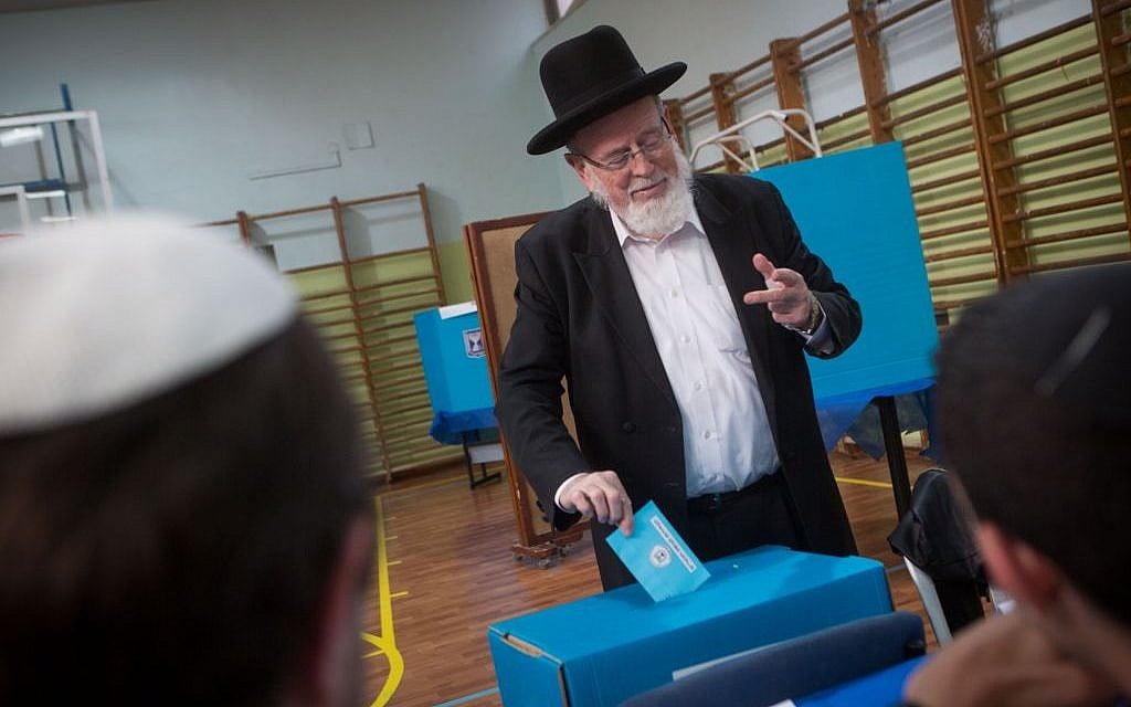 An ultra-Orthodox man casts his vote at a polling station in Jerusalem on March 17, 2015. (Photo credit: Miriam Alster/FLASH90)
