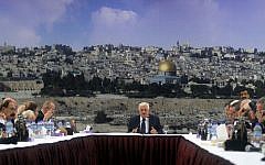 Mahmoud Abbas speaks during a meeting of the Palestinian leadership in the West Bank city of Ramallah to discuss canceling security coordination with Israel on December 14, 2014. Behind him is a view of Jerusalem's Old City (Photo credit: FLASH90)