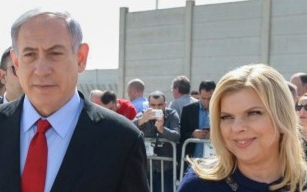 Prime Minister Benjamin Netanyahu and his wife, Sara, at Ben Gurion Airport as they depart for the United States on Sunday, March 1, 2015. (photo credit: Amos Ben Gershom / GPO)