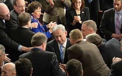 Prime Minister Benjamin Netanyahu is greeted by members of Congress on Capitol Hill in Washington, DC, March 3, 2015. (Amos Ben Gershom/GPO)