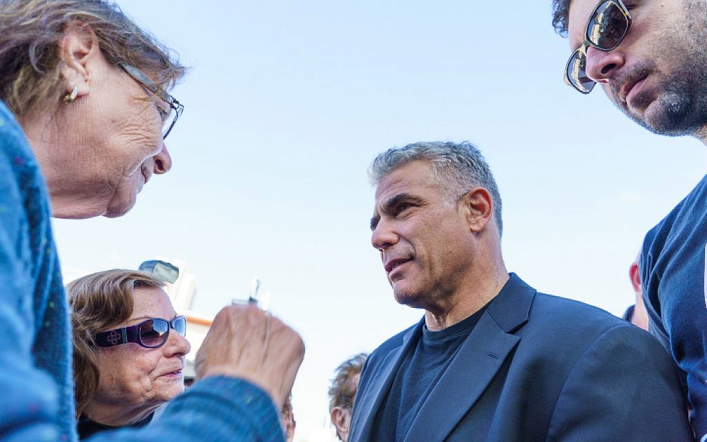 Yesh Atid party leader Yair Lapid speaks to voters on March 16, 2015. (Meir Vaknin/Flash90) Yesh Atid party leader Yair Lapid speaks to voters on March 16, 2015. (Meir Vaknin/Flash90)